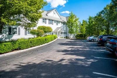 a driveway leading up to a building