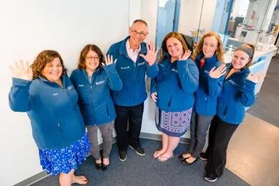 a group of medical providers waving